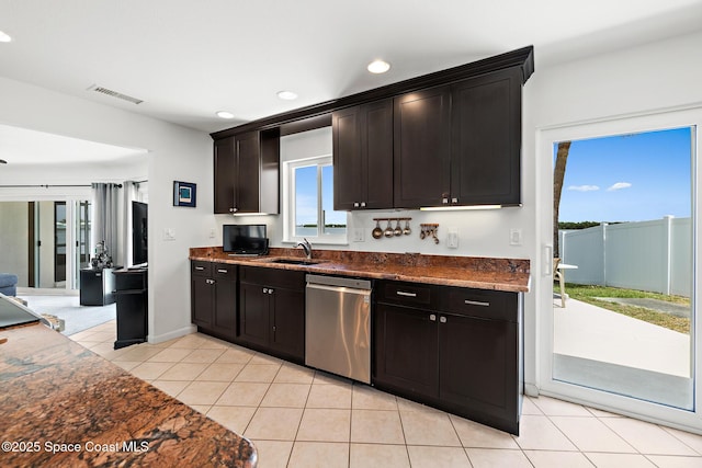 630 Paula Ave, Merritt Island, FL 32953 - kitchen featuring stainless steel dishwasher, a sink, light tile patterned flooring, recessed lighting, and dark stone counters