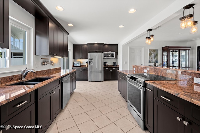 630 Paula Ave, Merritt Island, FL 32953 - kitchen with stainless steel appliances, a sink, pendant lighting, light tile patterned floors, and recessed lighting