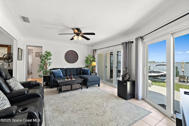 630 Paula Ave, Merritt Island, FL 32953 - living area featuring ceiling fan and light tile patterned floors