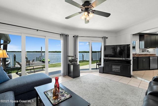 630 Paula Ave, Merritt Island, FL 32953 - living area featuring light tile patterned floors and ceiling fan