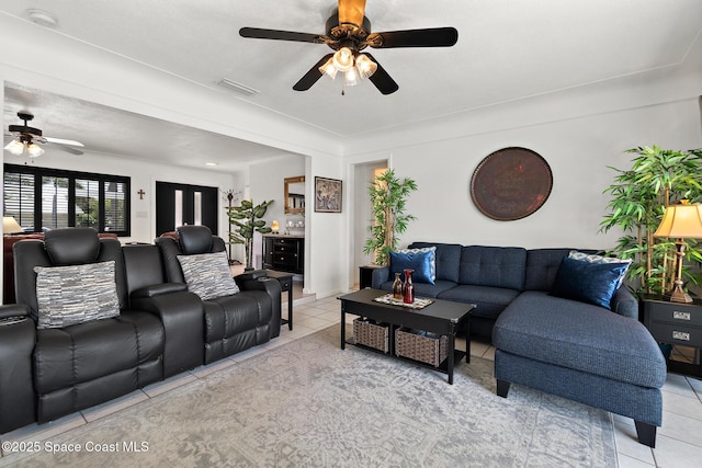 630 Paula Ave, Merritt Island, FL 32953 - living room featuring a ceiling fan and light tile patterned floors