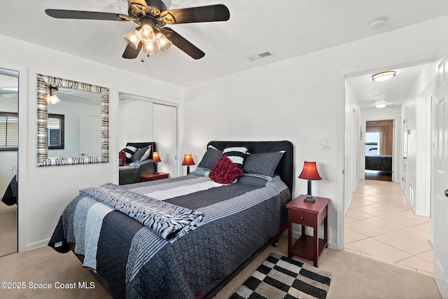 630 Paula Ave, Merritt Island, FL 32953 - bedroom featuring ceiling fan, tile patterned floors, and carpet floors