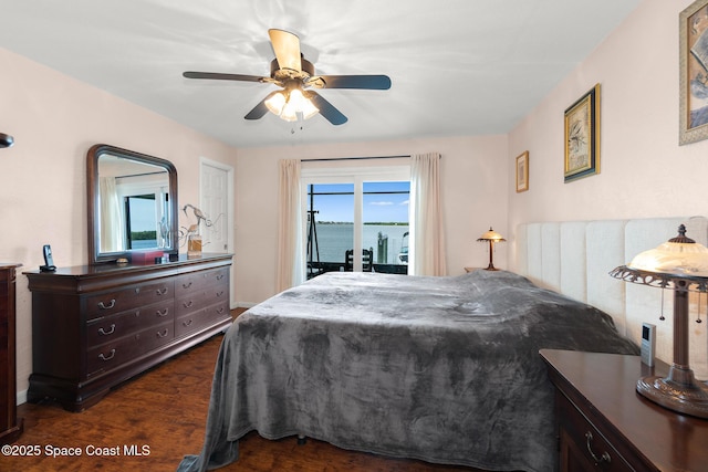 630 Paula Ave, Merritt Island, FL 32953 - bedroom with access to outside, dark wood-style flooring, and ceiling fan