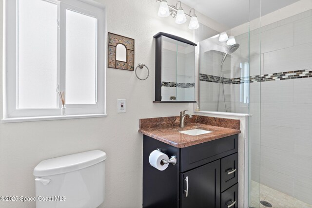 630 Paula Ave, Merritt Island, FL 32953 - bathroom with a shower stall, toilet, and vanity