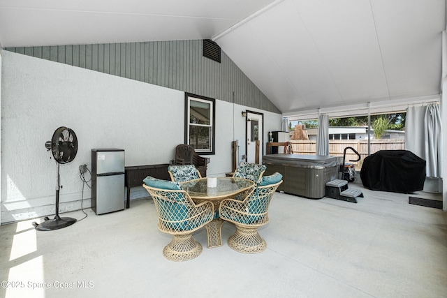 sunroom with a jacuzzi