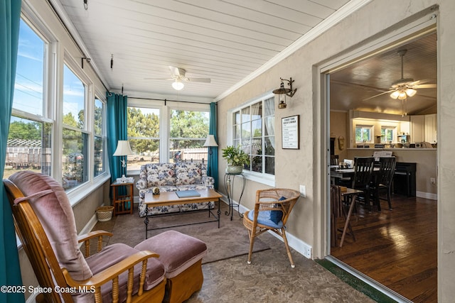 sunroom with a ceiling fan