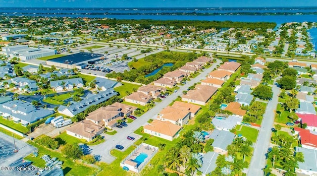 bird's eye view featuring a residential view and a water view