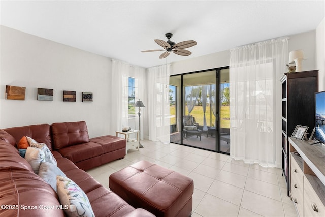 living room featuring a ceiling fan and light tile patterned flooring