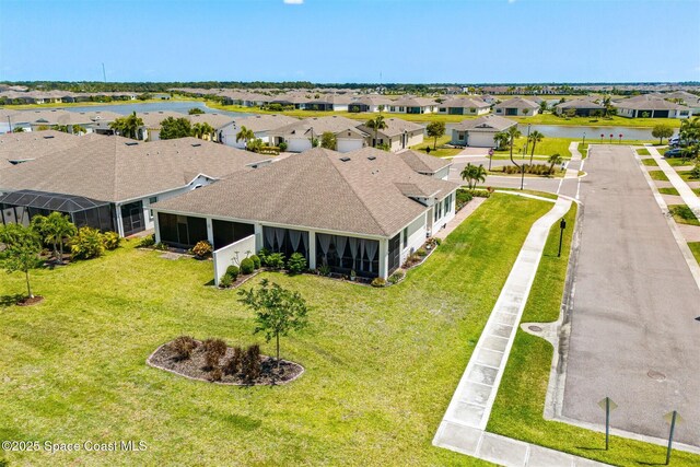aerial view featuring a residential view and a water view