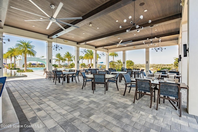 view of patio featuring outdoor dining space and a ceiling fan