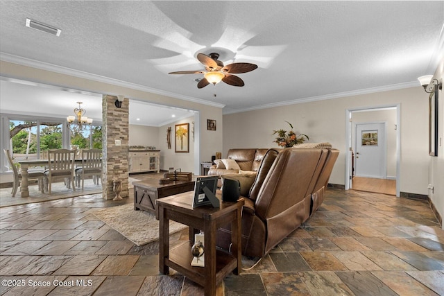 800 Hidden Oaks Ln, Oak Hill, FL 32759 - living area featuring stone tile floors, visible vents, crown molding, baseboards, and ceiling fan with notable chandelier