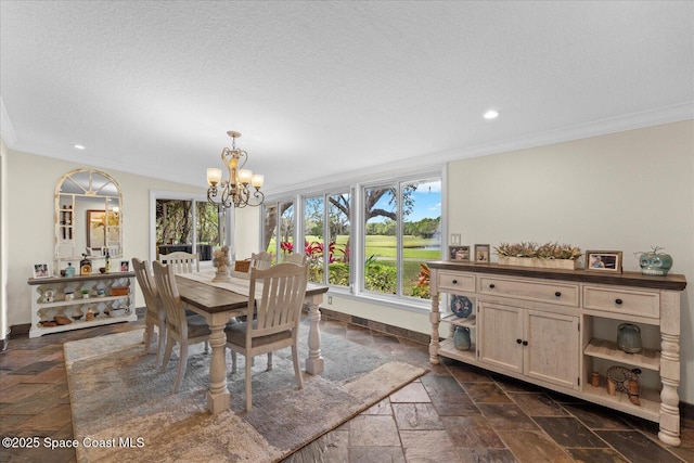 800 Hidden Oaks Ln, Oak Hill, FL 32759 - dining space featuring recessed lighting, stone tile floors, an inviting chandelier, ornamental molding, and baseboards