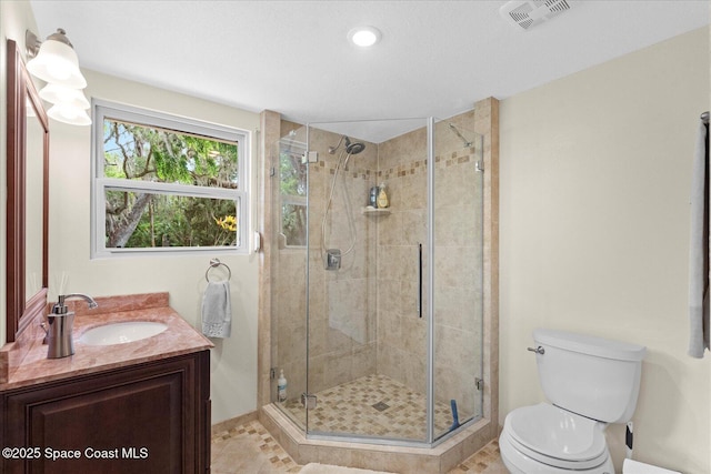 800 Hidden Oaks Ln, Oak Hill, FL 32759 - full bath with toilet, a stall shower, visible vents, recessed lighting, and vanity