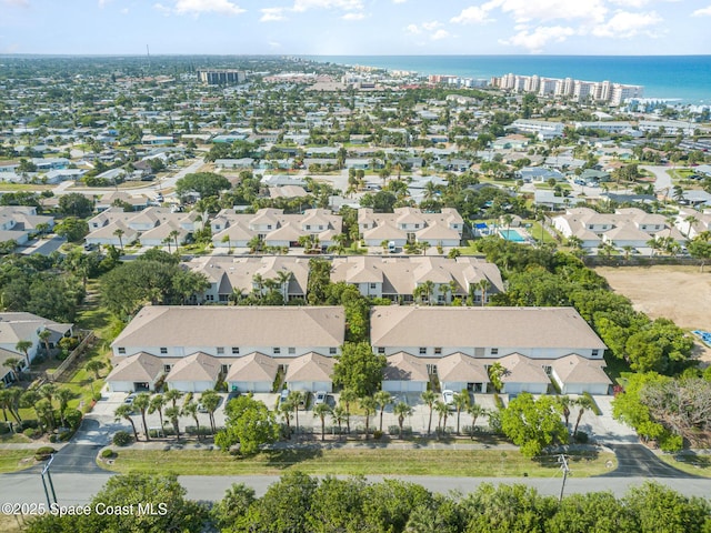 aerial view of property's location featuring a nearby body of water