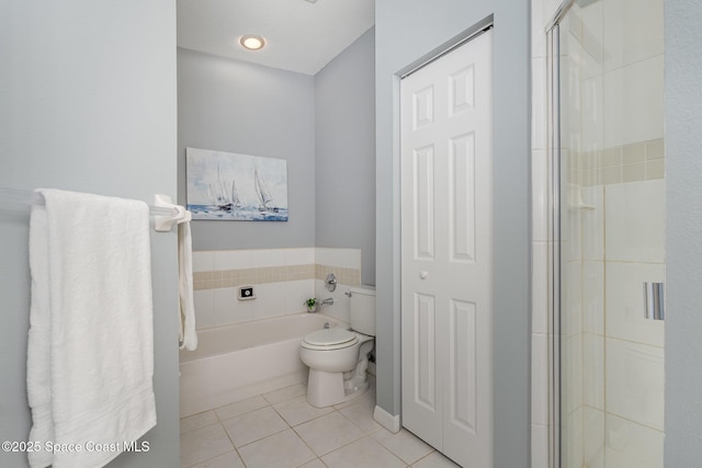 full bath featuring tile patterned floors, a stall shower, toilet, and a bath