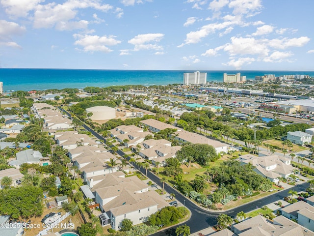 aerial view of property and surrounding area featuring a large body of water