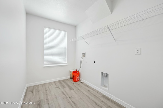 clothes washing area with laundry area, wood finished floors, baseboards, electric dryer hookup, and washer hookup