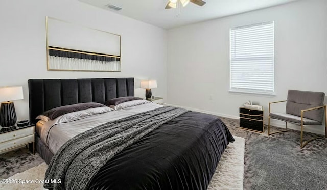 carpeted bedroom with baseboards, visible vents, and ceiling fan