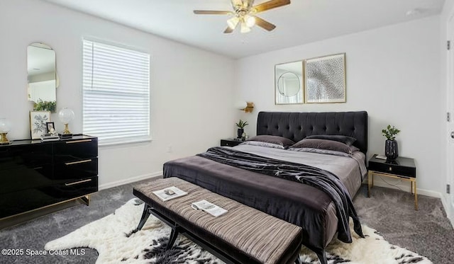 carpeted bedroom with a ceiling fan and baseboards