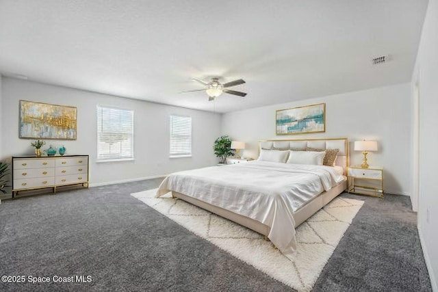 bedroom with baseboards, visible vents, carpet floors, and ceiling fan