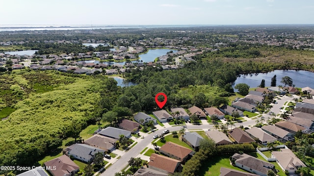 1773 Sun Gazer Dr, Rockledge, FL 32955 - aerial view featuring a water view and a residential view