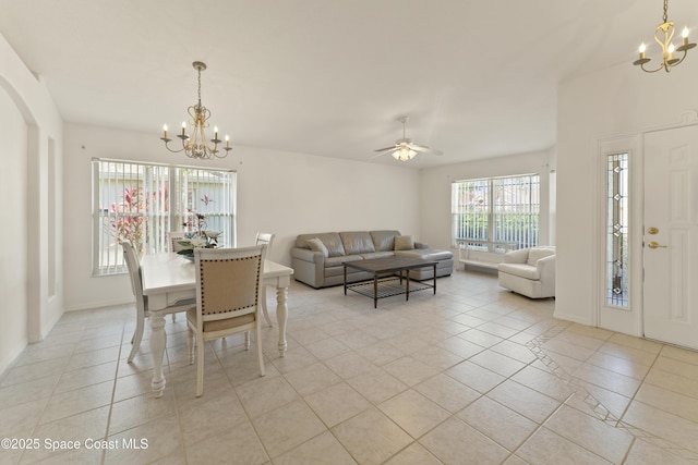 1773 Sun Gazer Dr, Rockledge, FL 32955 - dining space with ceiling fan with notable chandelier and light tile patterned floors