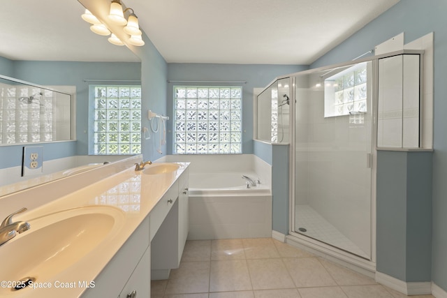 1773 Sun Gazer Dr, Rockledge, FL 32955 - full bathroom with a garden tub, a sink, and a stall shower