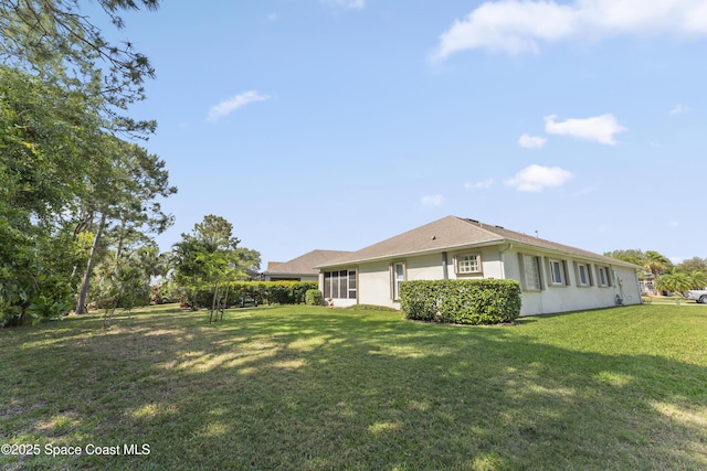 1773 Sun Gazer Dr, Rockledge, FL 32955 - exterior space featuring a lawn and stucco siding