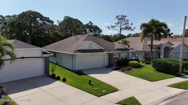 1773 Sun Gazer Dr, Rockledge, FL 32955 - ranch-style house with stucco siding, driveway, and a front yard
