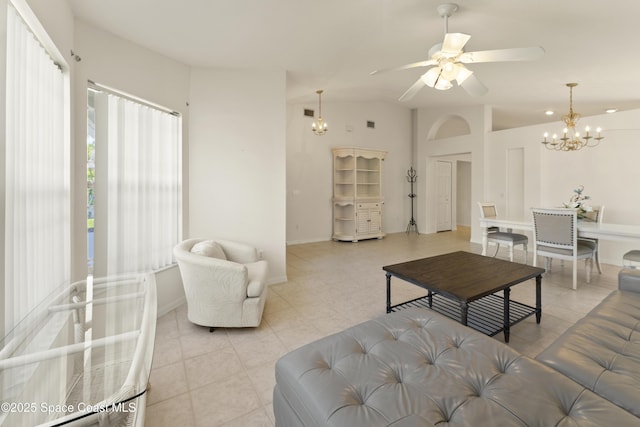 1773 Sun Gazer Dr, Rockledge, FL 32955 - living room featuring ceiling fan with notable chandelier, baseboards, and light tile patterned floors