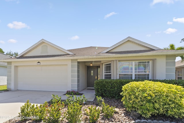 1773 Sun Gazer Dr, Rockledge, FL 32955 - ranch-style home with stucco siding, concrete driveway, a shingled roof, and a garage
