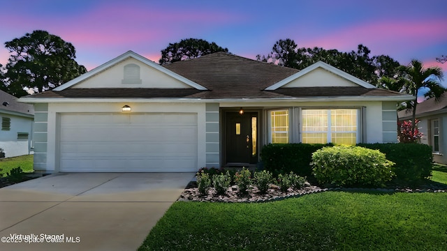 1773 Sun Gazer Dr, Rockledge, FL 32955 - view of front of home with roof with shingles, driveway, an attached garage, a yard, and stucco siding