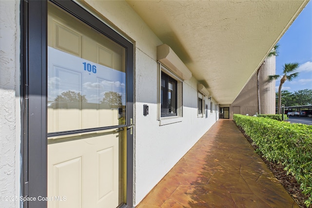 300 S Sykes Creek Pkwy Unit 106, Merritt Island, FL 32952 - entrance to property featuring stucco siding