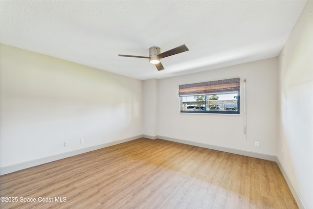 300 S Sykes Creek Pkwy Unit 106, Merritt Island, FL 32952 - spare room with baseboards, a ceiling fan, and light wood-type flooring