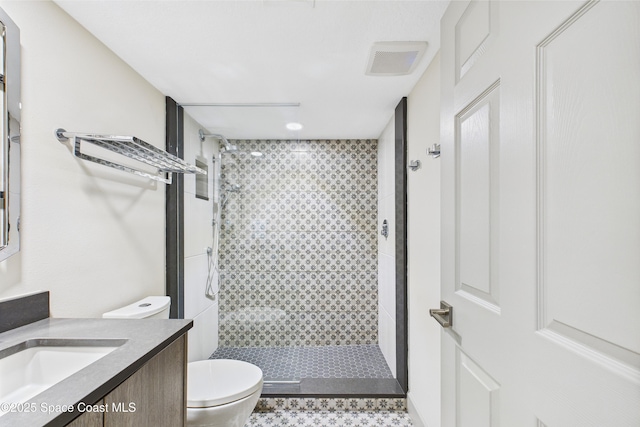 300 S Sykes Creek Pkwy Unit 106, Merritt Island, FL 32952 - bathroom featuring visible vents, a stall shower, toilet, and vanity