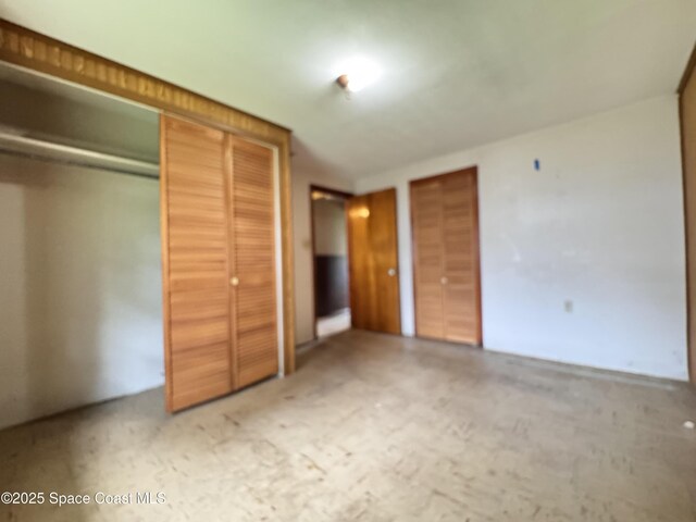 690 Lemon Grove Ave, Melbourne, FL 32904 - unfurnished bedroom with multiple closets