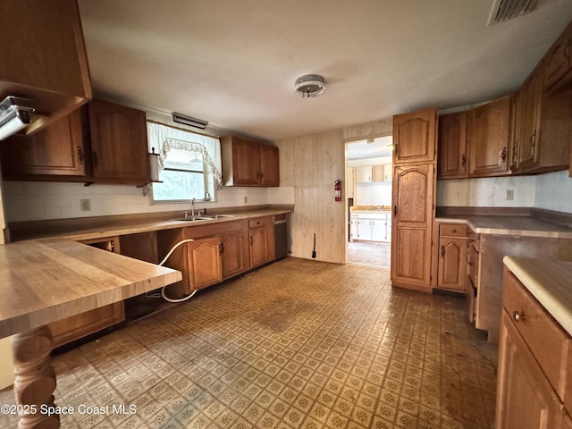 690 Lemon Grove Ave, Melbourne, FL 32904 - kitchen featuring brown cabinetry and backsplash