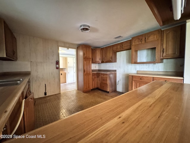 690 Lemon Grove Ave, Melbourne, FL 32904 - kitchen with brown cabinets
