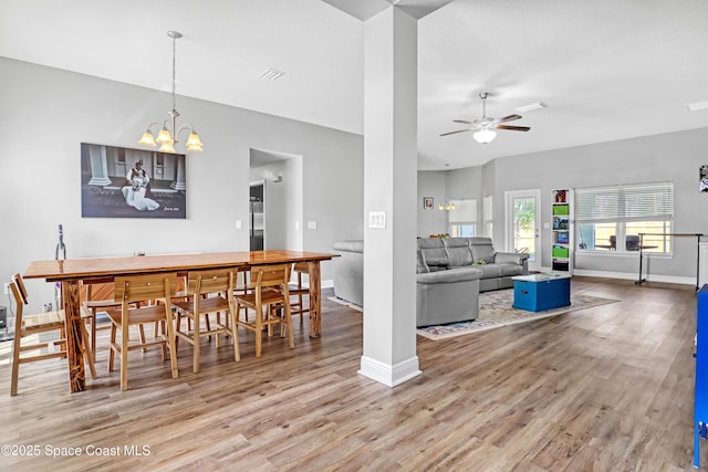 1307 Lotus St SE, Palm Bay, FL 32909 - dining room featuring wood finished floors, a ceiling fan, and baseboards