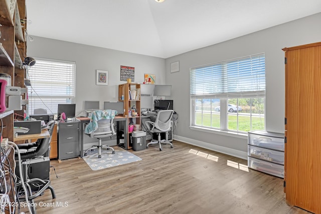 1307 Lotus St SE, Palm Bay, FL 32909 - office space featuring wood finished floors, vaulted ceiling, and baseboards