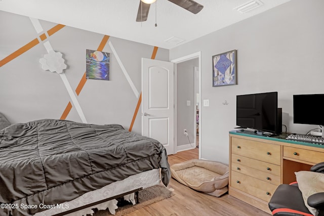 1307 Lotus St SE, Palm Bay, FL 32909 - bedroom featuring light wood-type flooring and a ceiling fan