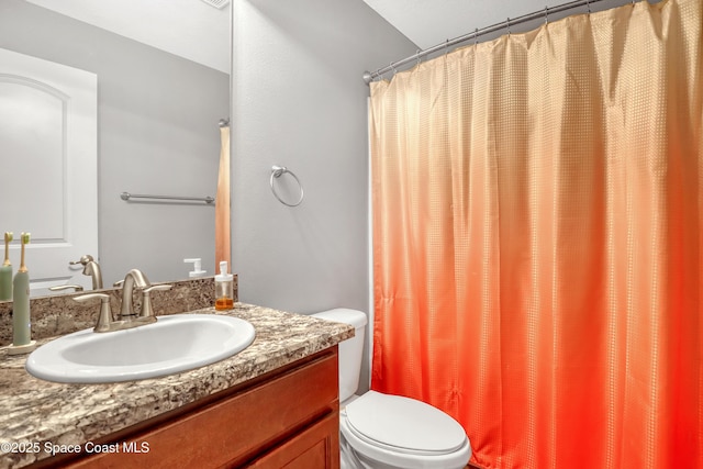 1307 Lotus St SE, Palm Bay, FL 32909 - bathroom with toilet, vanity, and curtained shower