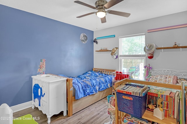 1307 Lotus St SE, Palm Bay, FL 32909 - bedroom with wood finished floors and a ceiling fan