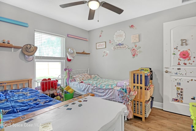 1307 Lotus St SE, Palm Bay, FL 32909 - bedroom with light wood-style flooring and a ceiling fan
