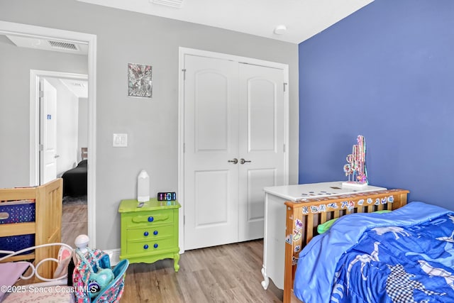 1307 Lotus St SE, Palm Bay, FL 32909 - bedroom with wood finished floors and a closet