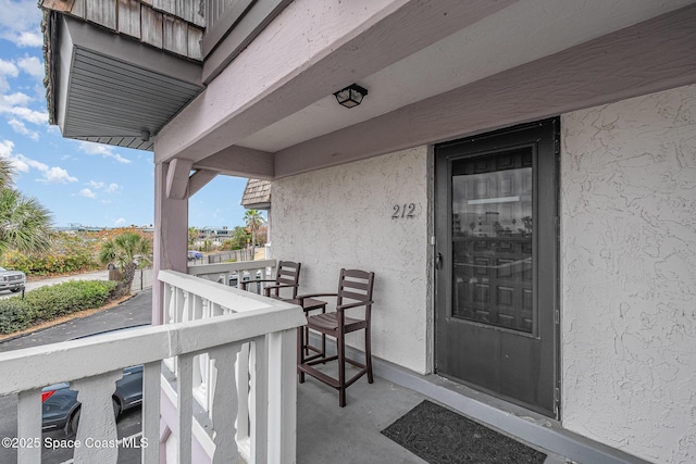 5350 Ocean Beach Blvd Unit 212, Cocoa Beach, FL 32931 - property entrance with stucco siding
