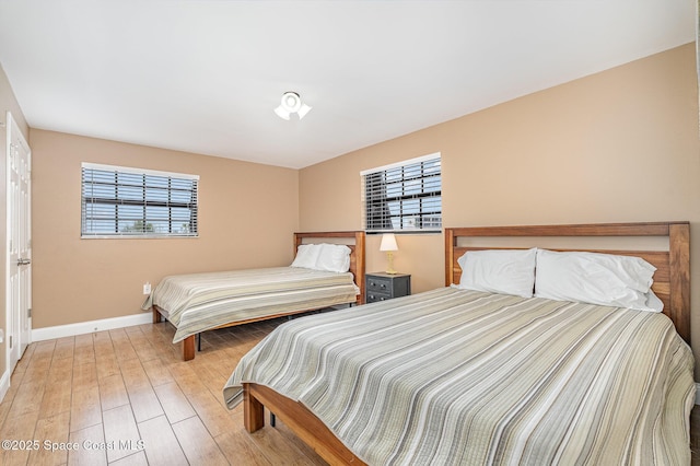 5350 Ocean Beach Blvd Unit 212, Cocoa Beach, FL 32931 - bedroom featuring light wood finished floors and baseboards