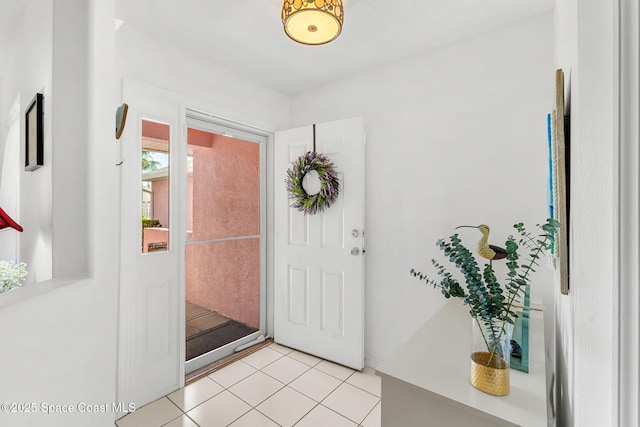 foyer featuring light tile patterned flooring