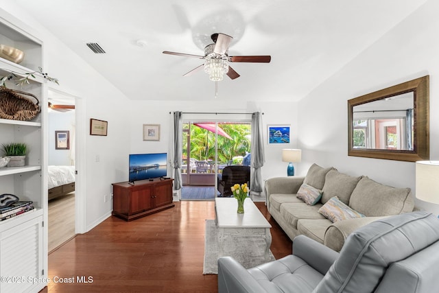 living room with visible vents, baseboards, ceiling fan, and wood finished floors