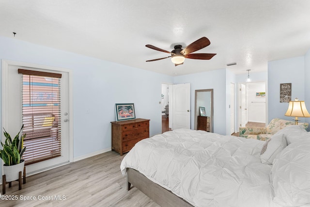 bedroom with visible vents, access to exterior, light wood-style floors, baseboards, and ceiling fan